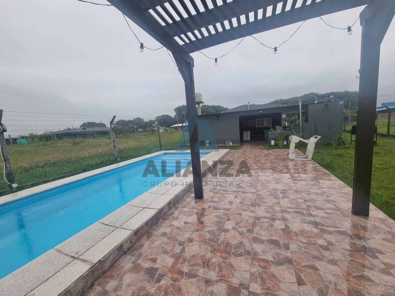 CASA EN VENTA A ESTRENAR DE DOS (2) DORMITORIOS EN BARRIO AMPLIACION EL MOLLAR 2, CON QUINCHO Y PILETA